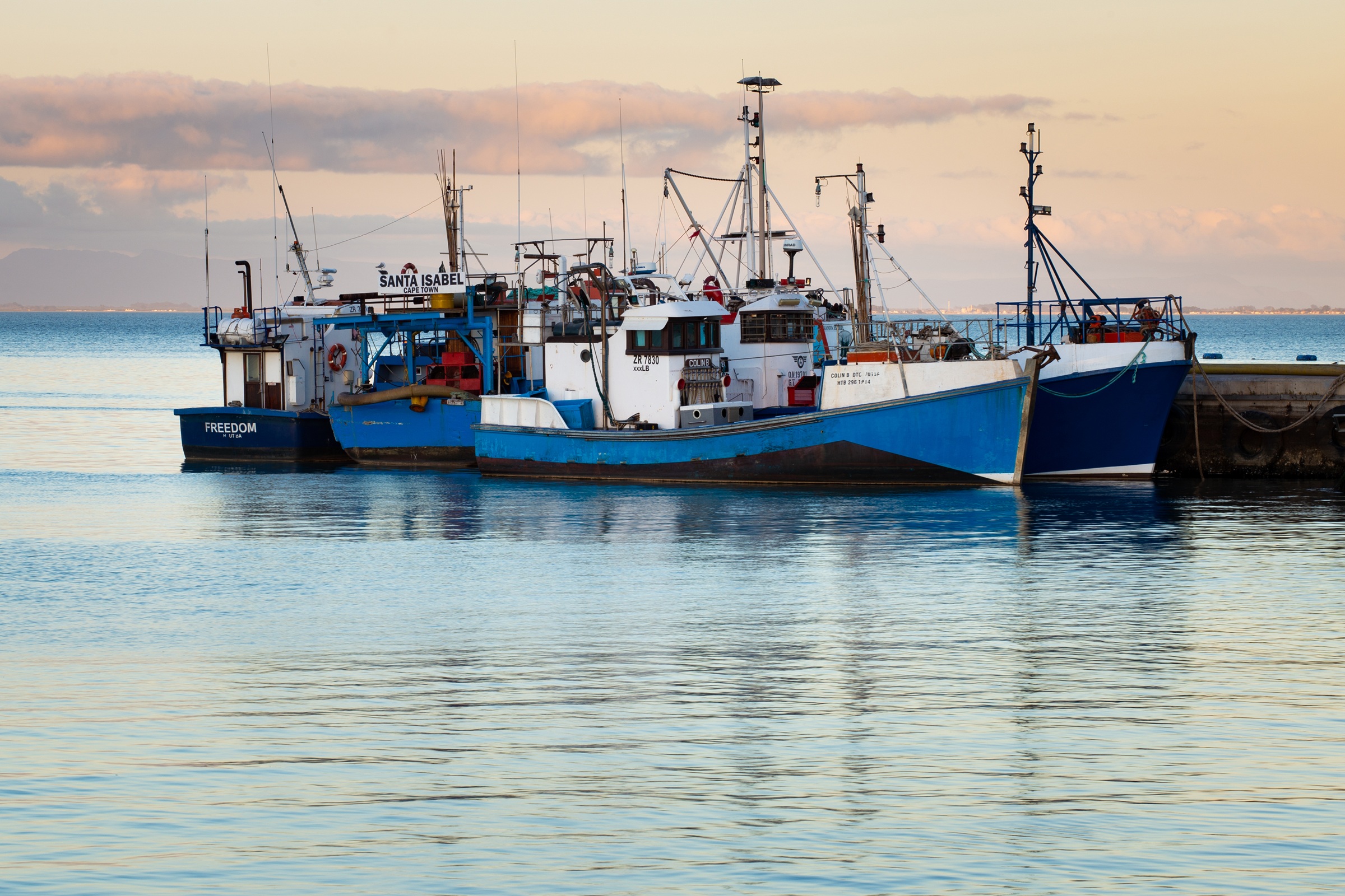 Working fishing boats moored in St Helena Bay harbour.