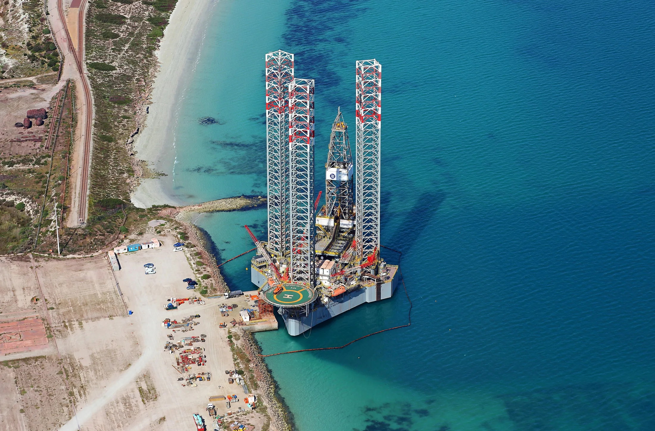 Industrial infrastructure beside the turquoise waters of Saldanha Bay.